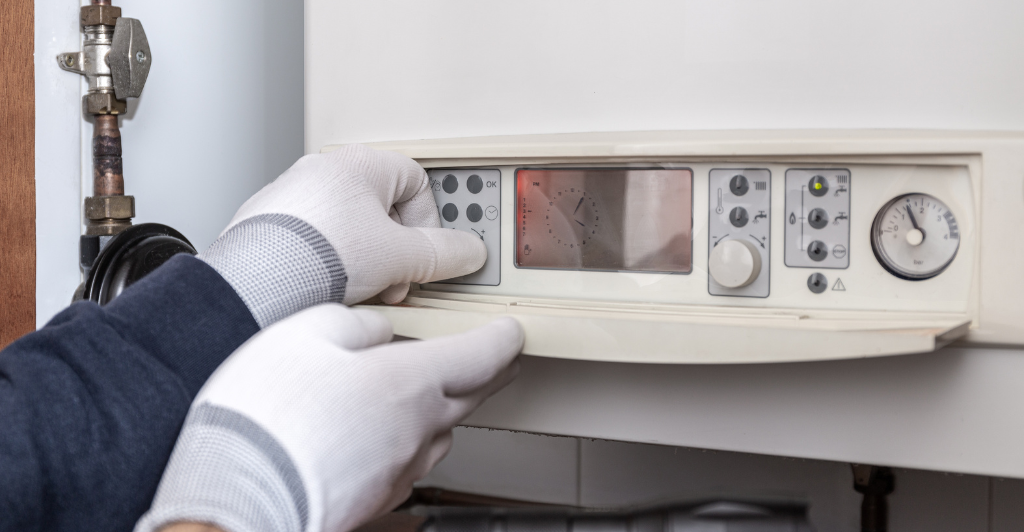 a man doing boiler servicing in bournemouth