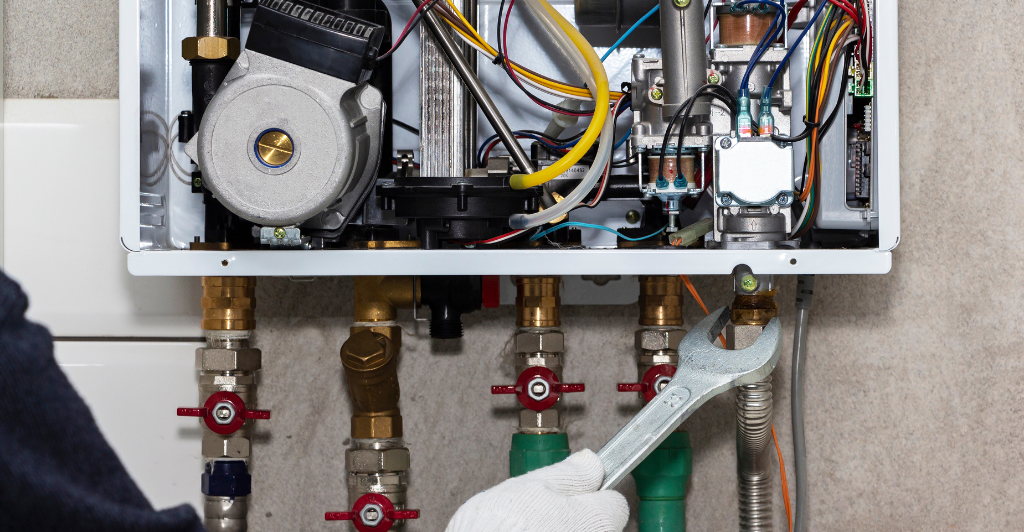 a man doing plumbing in bournemouth